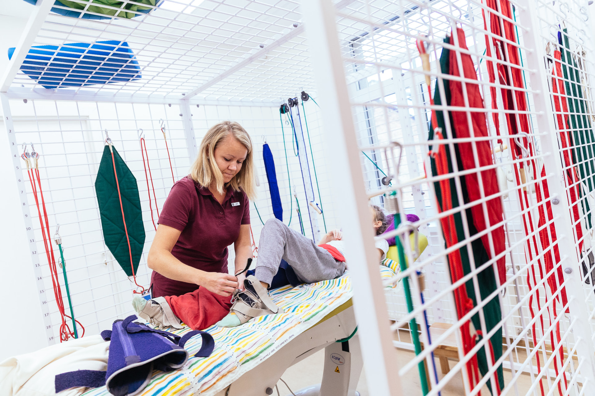 Physiotherapist working with a child at Center POGA in Riga